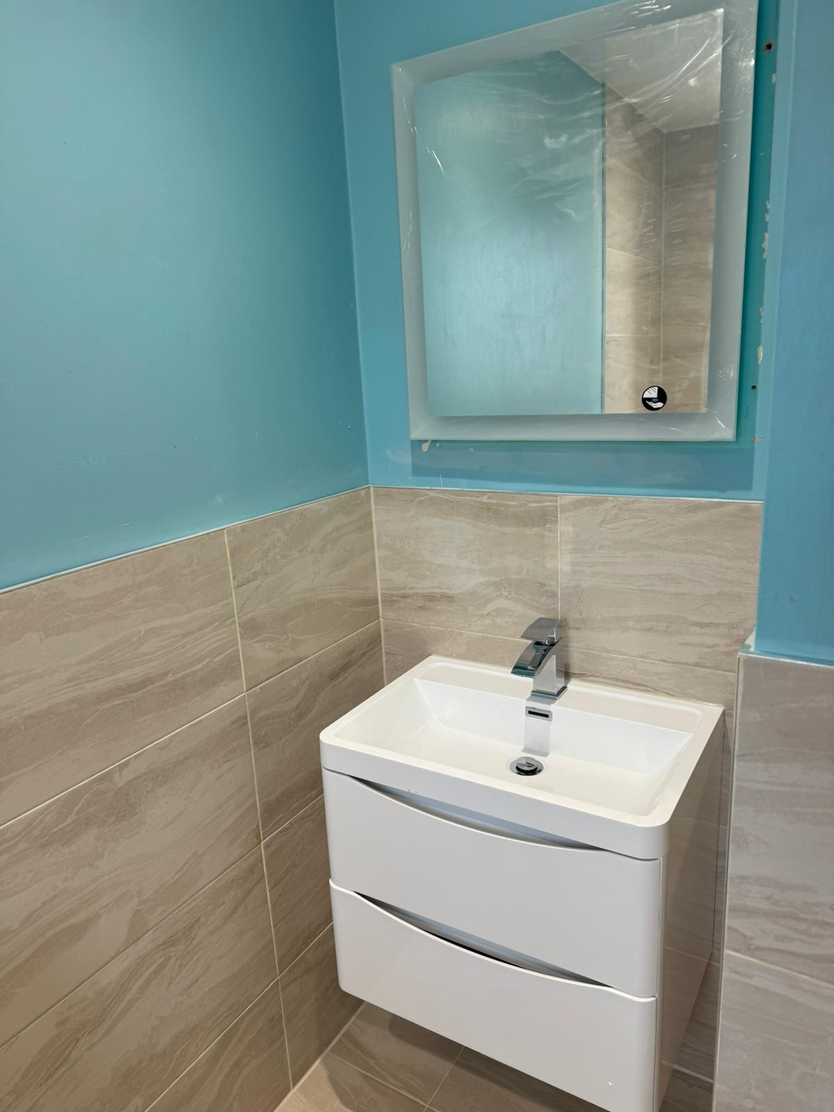 Back lit mirror and vanity unit Back lit mirror and vanity unit